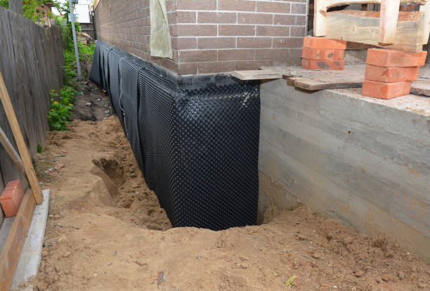 SJ Waterproofing Pros technician performing targeted Waterproofing assessment in Mundelein, IL